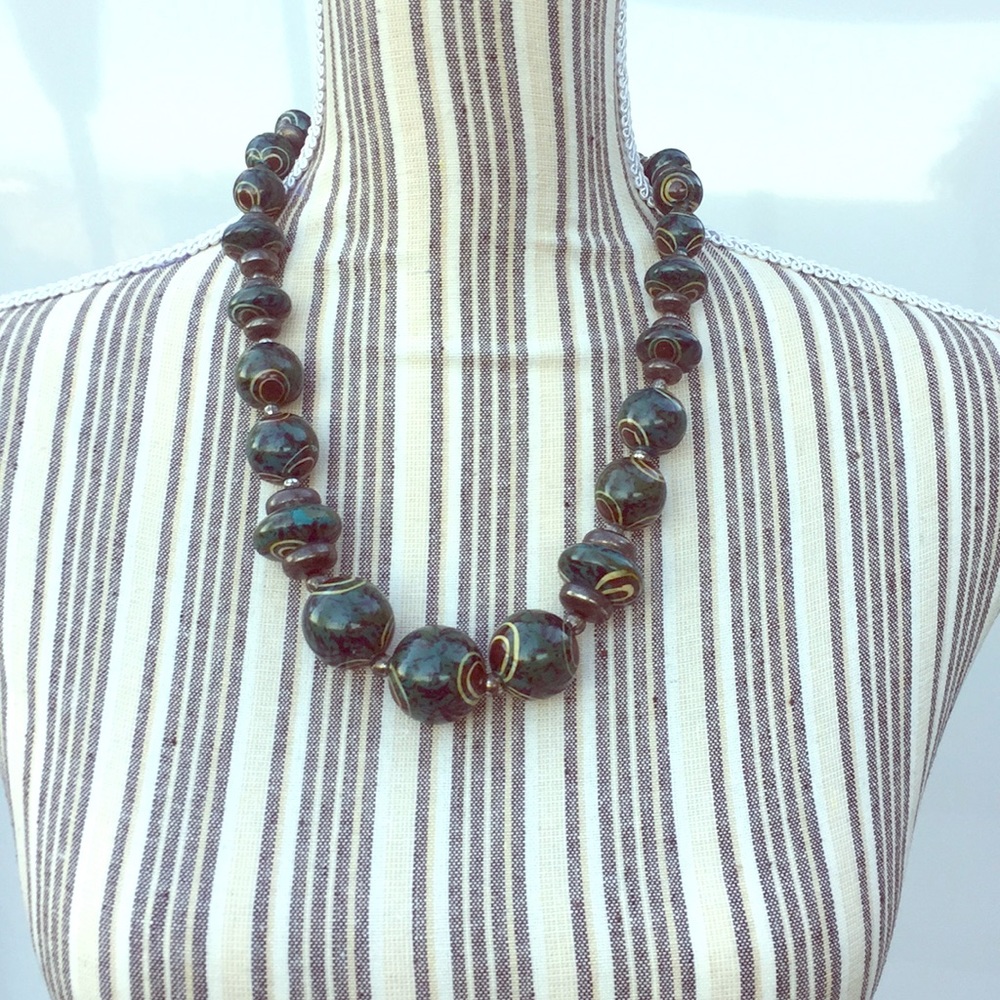 Silver and green hand-painted, beaded necklace.